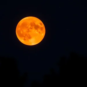 Blood Moon lunar eclipse with a starry background