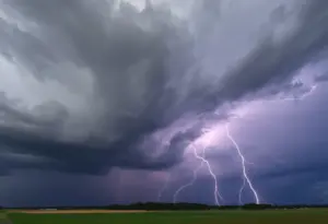 Dark thunderclouds with lightning over North Carolina landscape