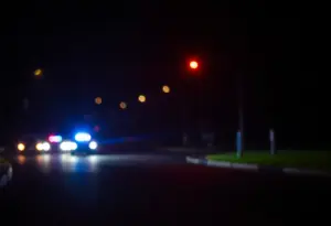 Police lights at night on a dark street