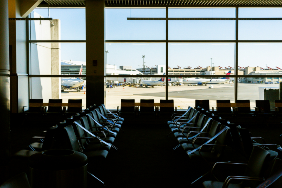 Airport terminal gate area with windows onto the tarmac