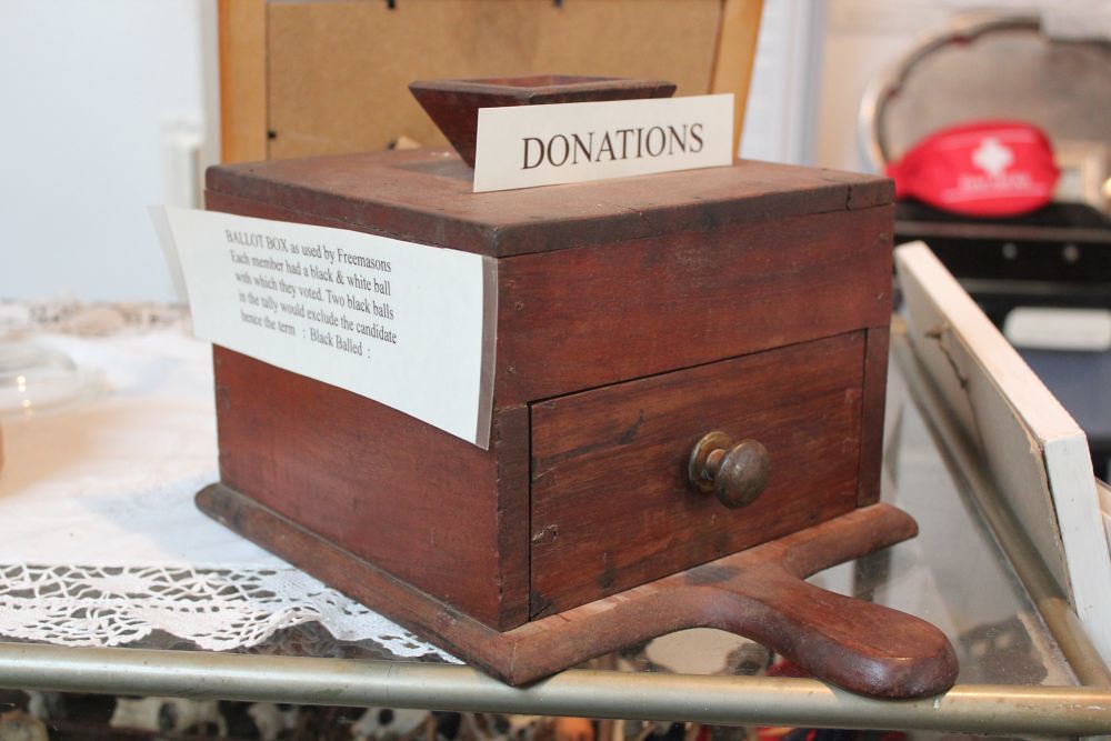 Wooden ballot box with a slot on top