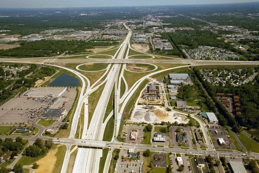 Cloverleaf highway interchange near a city