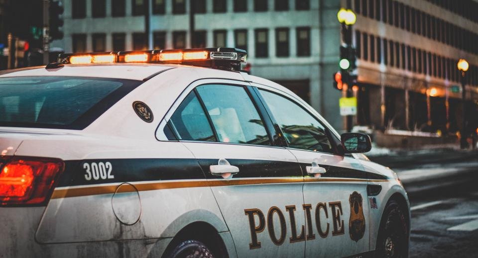 Police car with lights on a street